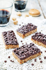 raw vegan dates oats peanut butter bars with chocolate frosting