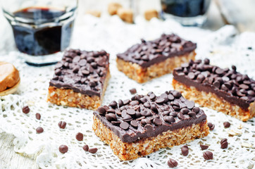 raw vegan dates oats peanut butter bars with chocolate frosting