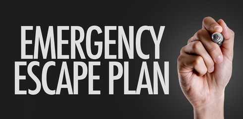 Hand writing the text: Emergency Escape Plan