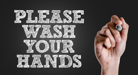 Hand writing the text: Please Wash Your Hands