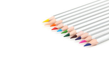 Colourful pencils on a white background, close up