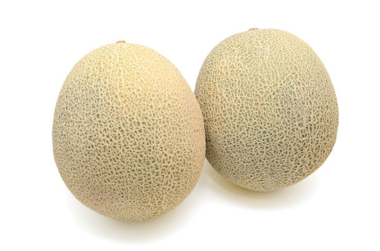 Cantaloupe melon slices isolated on white background