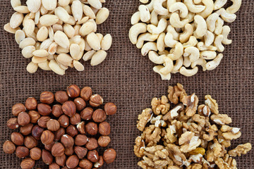 Almonds, cashew, walnuts and hazelnuts lying on burlap