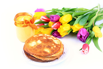 pancakes mango curd tulips on a white background