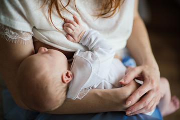 Mother breastfeeding her newborn baby