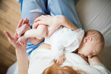 Mother breastfeeding her newborn baby
