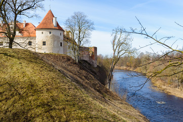 Fototapeta na wymiar Old medieval castle near river in Bauska town, Latvia