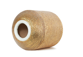 Horizontal spool of golden thread.