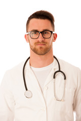 Fototapeta premium Handsome doctor in white robe with stethoscope around neck.