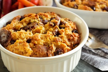 Bread pudding in a white ramekin close up