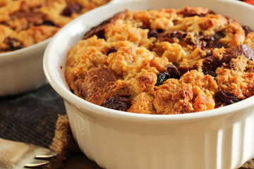 Bread pudding in a white ramekin close up