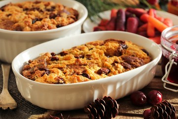 Bread pudding in a white ramekin side view