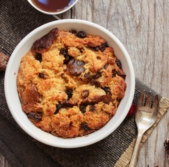 Bread pudding in a white ramekin top view