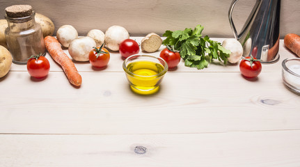 Naklejka na ściany i meble cooking vegetarian food, fresh mushrooms, carrots and parsley oil potatoes border ,place for text on wooden rustic background top view