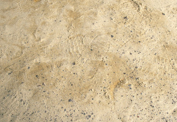 Print of shoes / Many print of shoes on the sand.