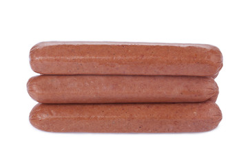 three uncooked hotdog