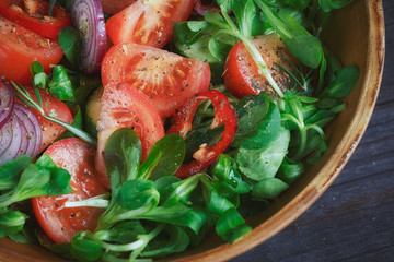 Fresh vegetable salad with tomatoes, cucumbers and onions. Serve