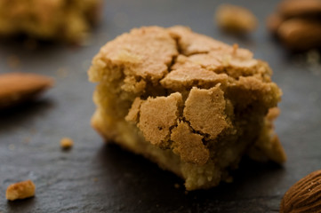 White chocolate and almond brownie on dark