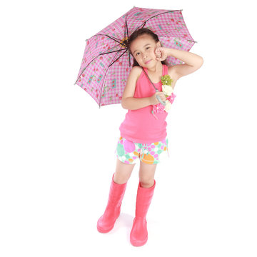 smiling little girl with umbrella and boots on white background