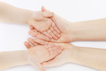 Children's hands in mother's hands