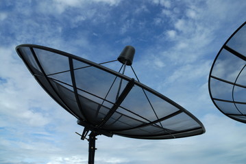 Satellite dish on blue sky with cloud