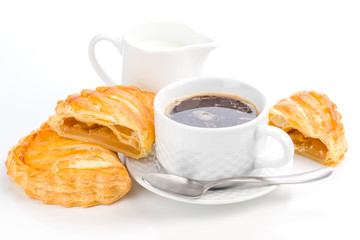 cup of coffee and milk with fresh stuffed pasta