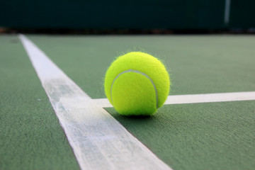 Tennis ball on tennis court