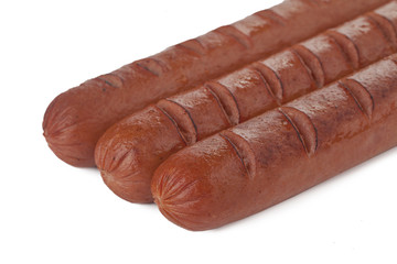 three grilled hotdogs