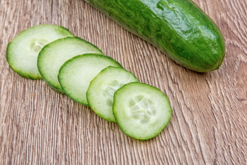 Cucumbers on a wooden background