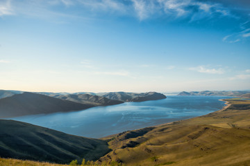 Beautiful landscape with hills and wide river 
