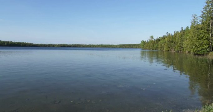 Panoramic view of calm water in Cyprus lake, on the Bruce peninsula in Ontario, Canada

