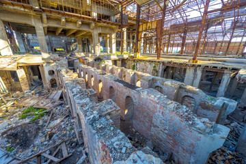 The interior of an abandoned old factory building. Impressive ru