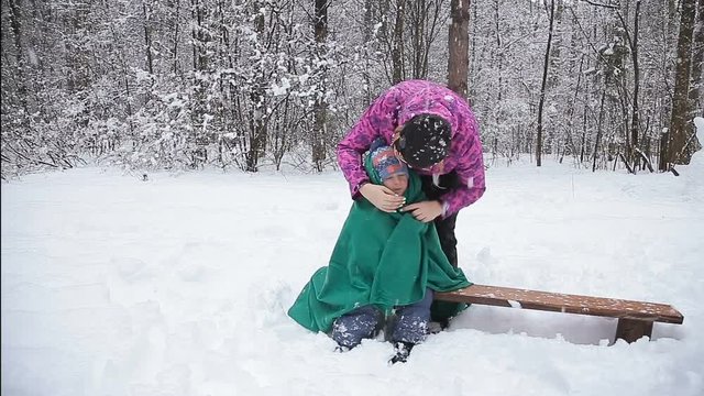 Winter fun, snow, happy children at winter time. Happy mother and son  playing with snow. family. Happy mother and baby playing with snow. Winter fun, snow, happy children at winter time