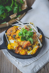 fried mussel pancake with old wooden background