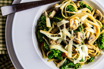 Homemade linguine with kale, mushrooms and muenster cheese