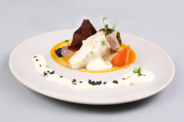 chicken breast with vegetables on a white plate.