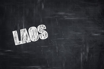Chalkboard background with chalk letters: Greetings from laos