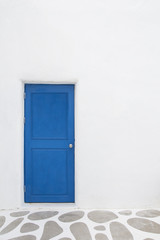 White Wall With Blue Door