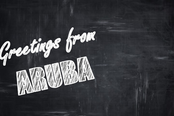Chalkboard background with chalk letters: Greetings from aruba