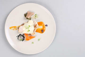 chicken breast with vegetables on a white plate.
