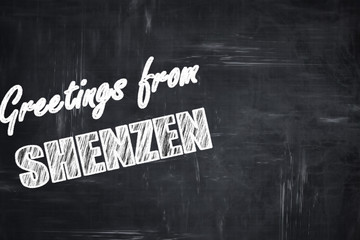 Chalkboard background with chalk letters: Greetings from shenzen