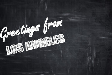 Chalkboard background with chalk letters: Greetings from los ang