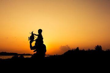 Fototapeta na wymiar silhouette of dad and son plane plane sunset background