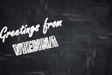 Chalkboard background with chalk letters: Greetings from vienna © Argus