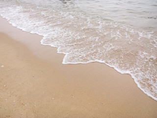 Soft wave of the sea on a sandy beach