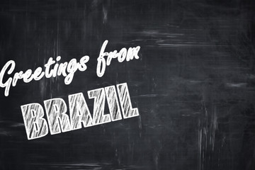 Chalkboard background with chalk letters: Greetings from brazil