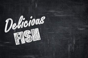 Chalkboard background with chalk letters: Delicious fish sign