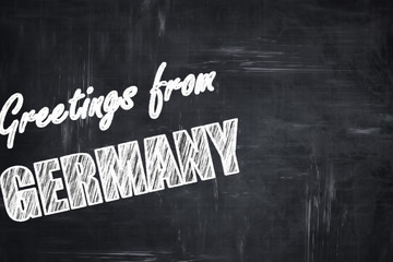 Chalkboard background with chalk letters: Greetings from germany