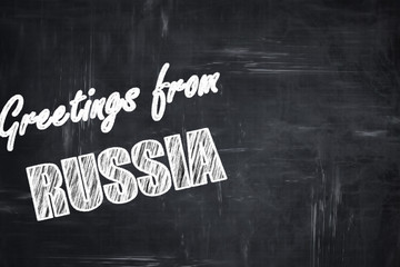 Chalkboard background with chalk letters: Greetings from russia
