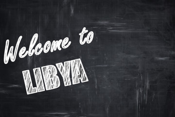 Chalkboard background with chalk letters: Welcome to libya